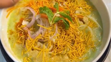 Chilled pani puri noodles topped with vegetables, sev, and crushed puris